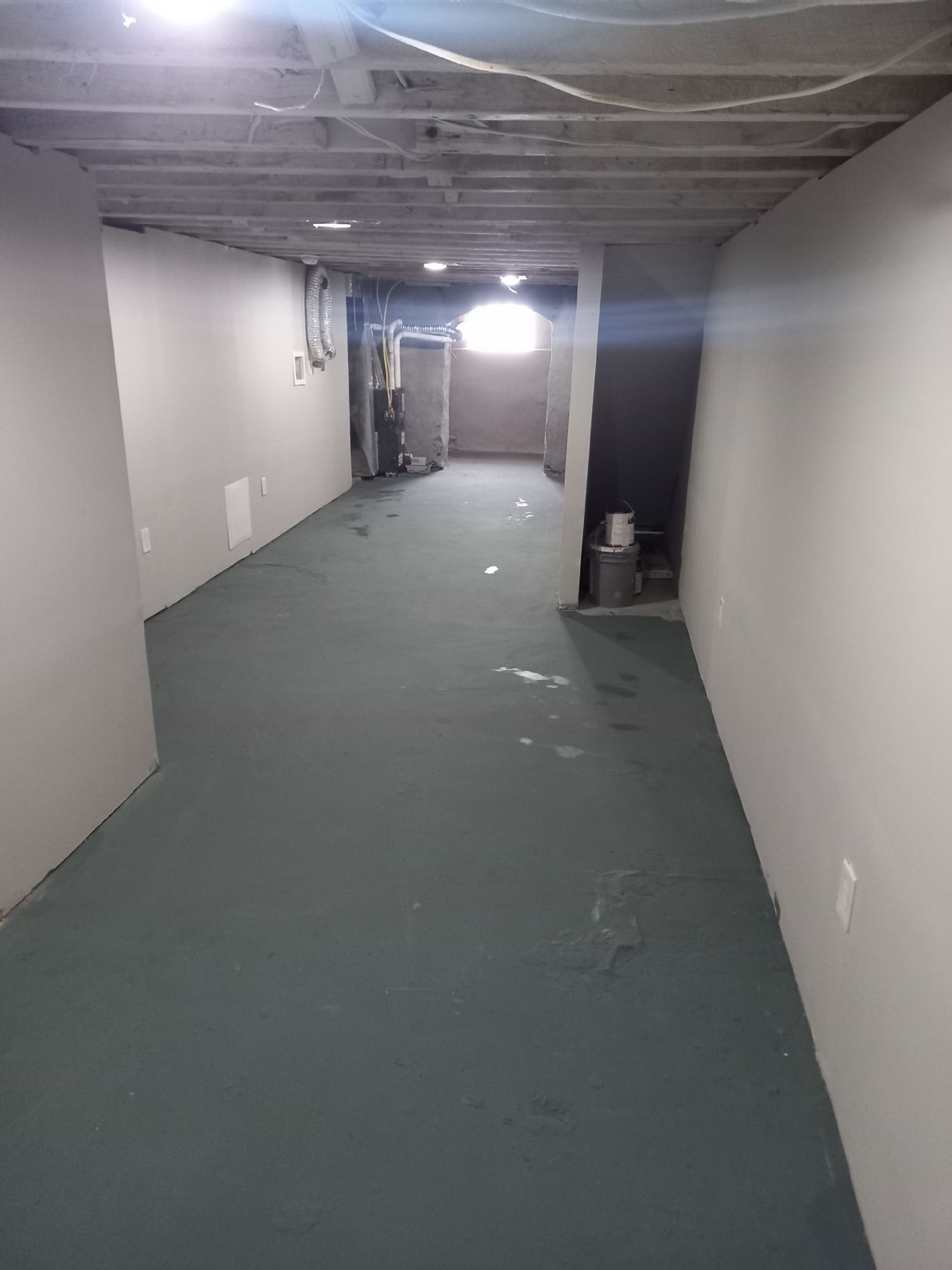 fully framed and finished basement with the rustic ceiling allure, hvac vents and numerous outlets